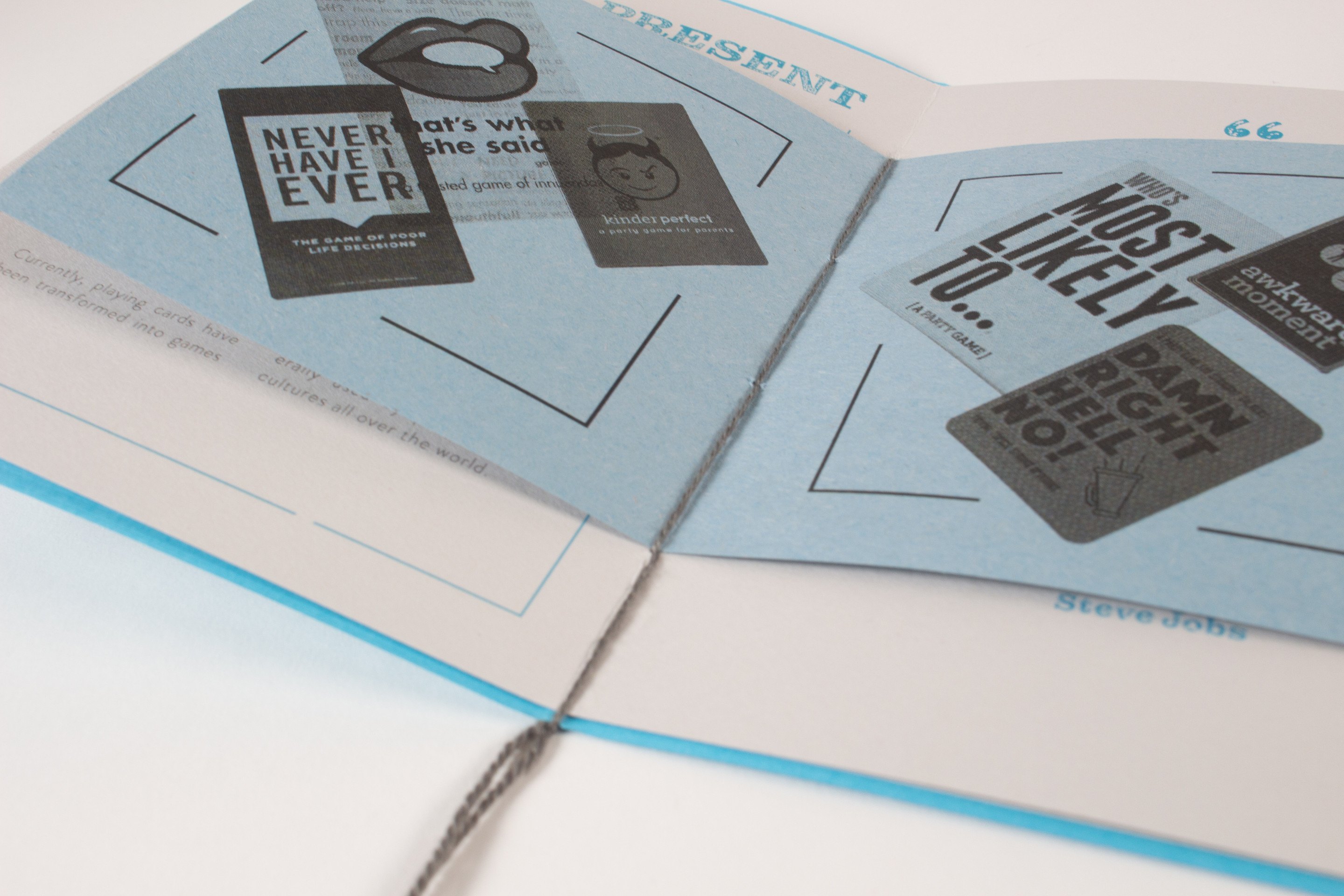 The third book open at a spread headed “Present”, printed cards reading “never have I ever” and “most likely to” laid over the pages