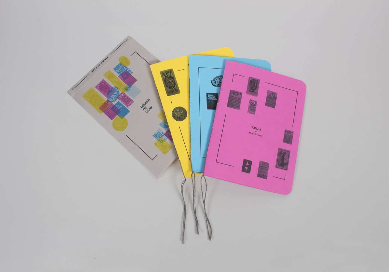 Design of Play: the four booklets fanned out