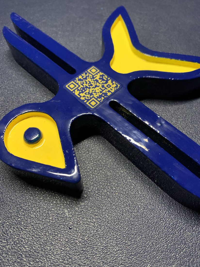 Close up of the printed logo with the scannable QR Code on its body