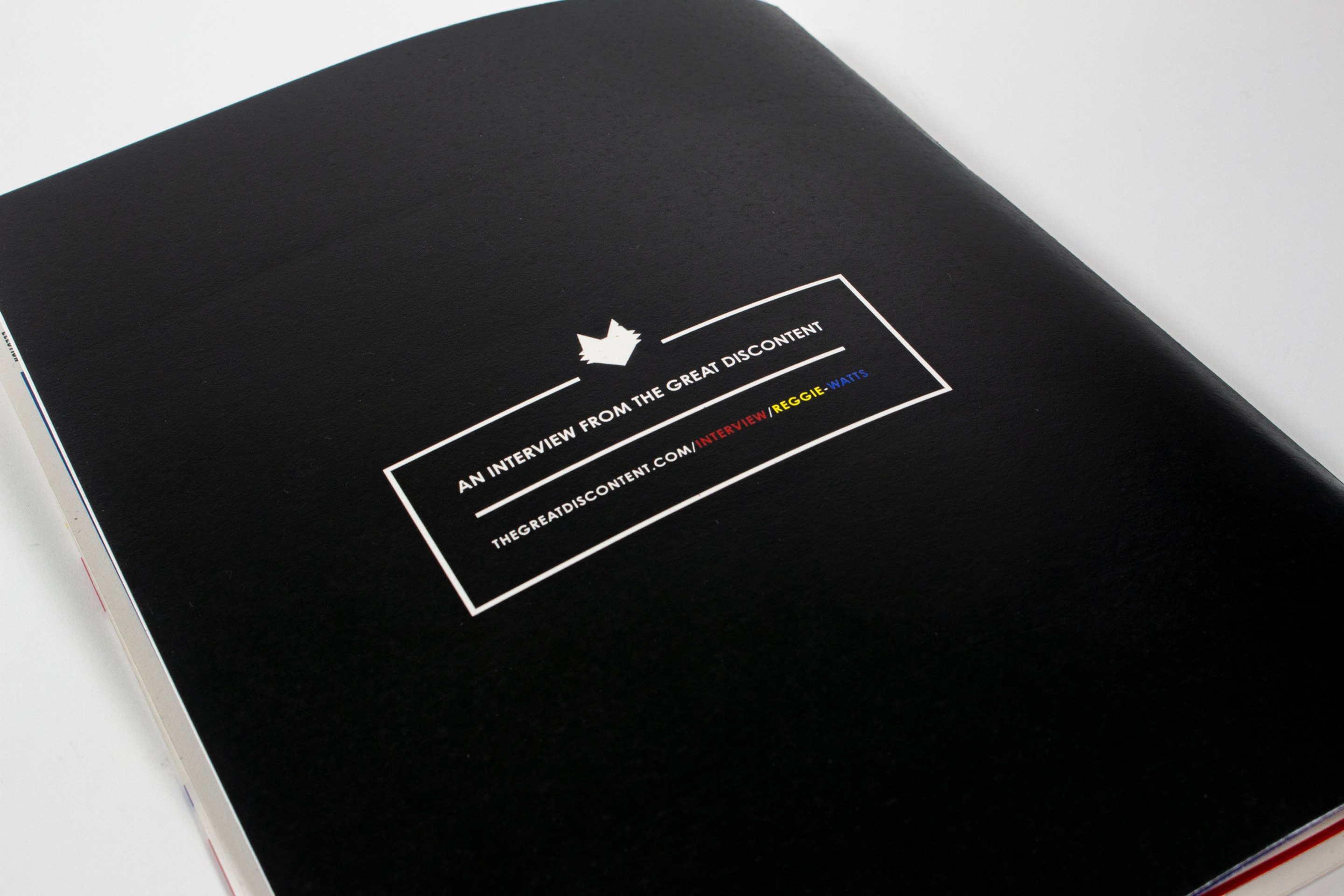 The back cover, black, with a small white-ruled box reading “an interview from The Great Discontent”